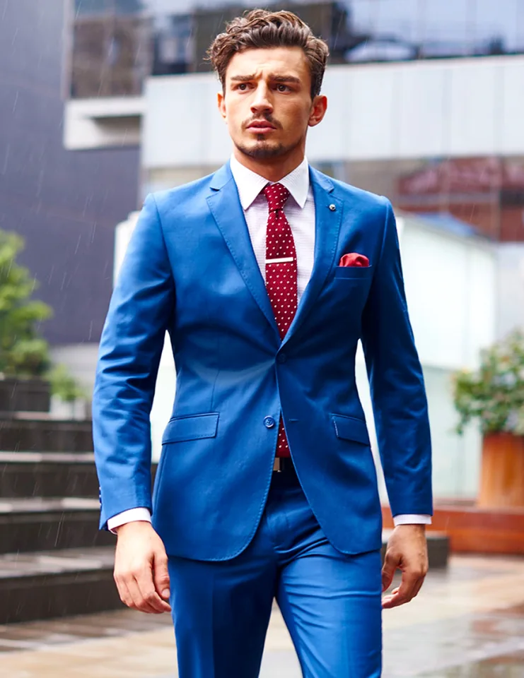 Blue formal suit with red tie