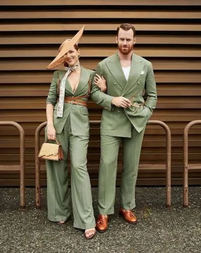 Couple in coordinated green suits