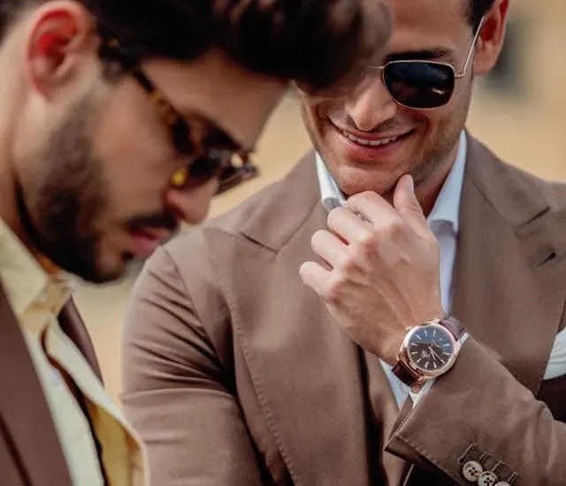 Gentlemen wearing tailored suits and watches